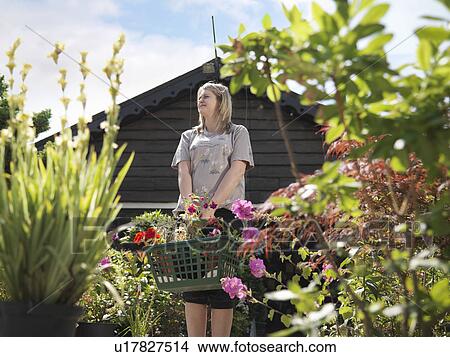 Female Buying Plants At Garden Center View Large Photo Image Picture - Female Buying Plants At Garden Center. Fotosearch