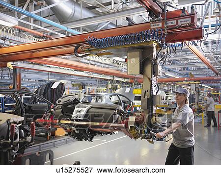 Stock Photo - Female Car Worker On Production Line. Fotosearch