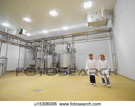 Stock Photograph - Food Workers Walking In Factory. Fotosearch