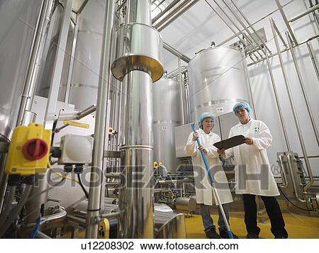 Stock Image - Food Workers With Clipboard & Mop. Fotosearch
