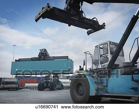 Fork Lifts Moving Shipping Containers View Large Photo Image Stock Image - Fork Lifts Moving Shipping Containers. Fotosearch