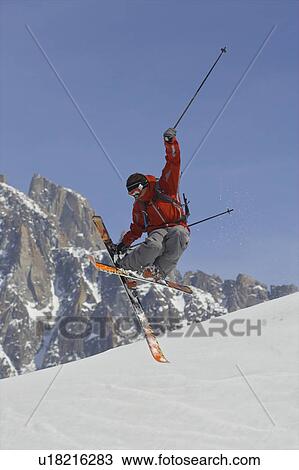 Freeride skier jumping into the air. View Large Photo Image Stock Image - Freeride skier jumping into the air.. Fotosearch