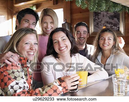friends laughing in ski bar View Large Photo Image Stock Image - friends laughing in ski bar. Fotosearch