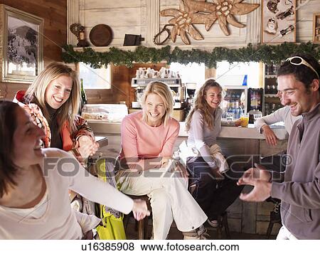 friends laughing in ski bar View Large Photo Image Stock Photo - friends laughing in ski bar. Fotosearch