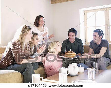 friends laughing with cake in chalet View Large Photo Image Stock Photograph - friends laughing with cake in chalet. Fotosearch