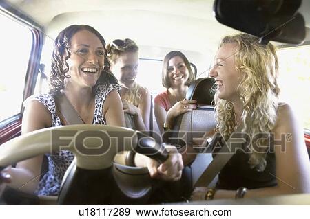 Stock Photo - Friends packing a car. Fotosearch