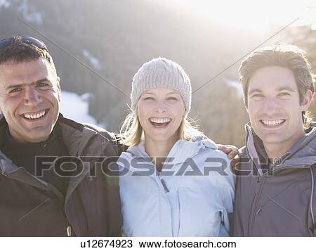 friends smiling in snowy scene View Large Photo Image Stock Image - friends smiling in snowy scene. Fotosearch