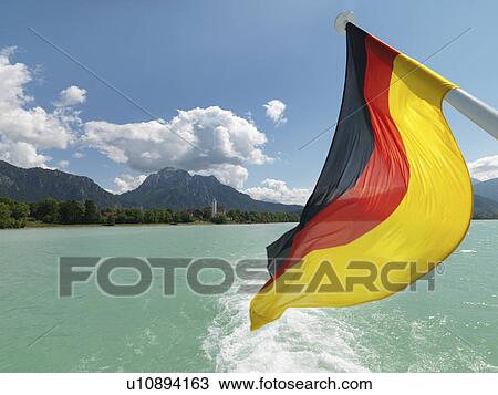 German national flag flying from pole View Large Photo Image Stock Image - German national flag flying from pole. Fotosearch