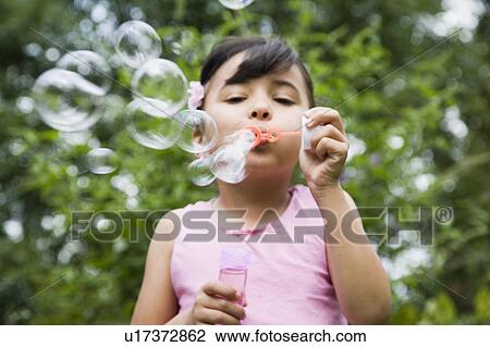 Girl Blowing Bubbles View Large Photo Image Stock Image - Girl Blowing Bubbles. Fotosearch