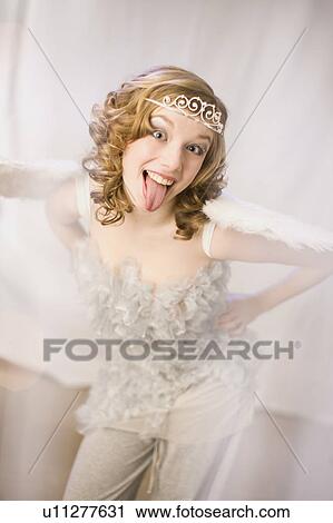girl dressed as a angel with tongue out View Large Photo Image Stock Image - girl dressed as a angel with tongue out. Fotosearch