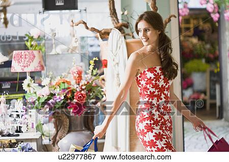 Stock Photo - girl having shopping fun. Fotosearch