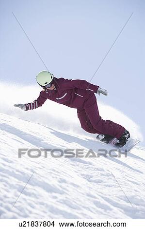 Girl in jumpsuit boarding down hill. View Large Photo Image Picture - Girl in jumpsuit boarding down hill.. Fotosearch