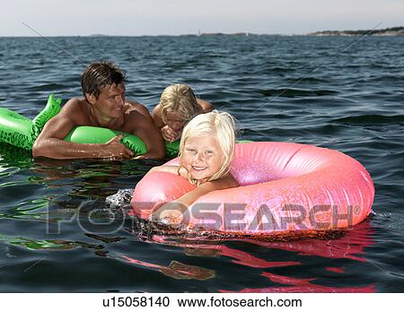 Stock Image - Girl on inflatable ring. Fotosearch
