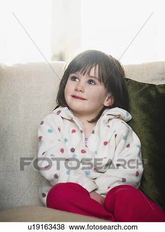 Girl on sofa View Large Photo Image Stock Photo - Girl on sofa. Fotosearch