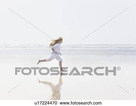 Girl running on beach View Large Photo Image Stock Image - Girl running on beach. Fotosearch