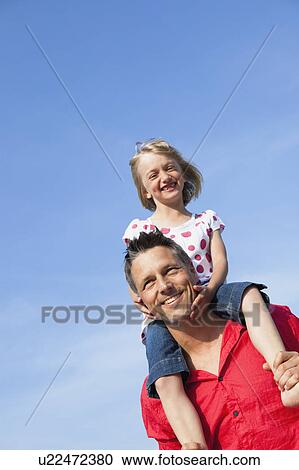 Girl Sitting On Fathers Shoulders View Large Photo Image Stock Image - Girl Sitting On Fathers Shoulders. Fotosearch