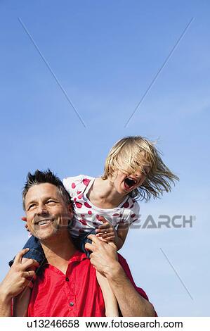 Girl Sitting On Fathers Shoulders View Large Photo Image Stock Photo - Girl Sitting On Fathers Shoulders. Fotosearch