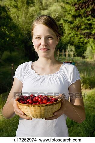 girl with basket of cherries View Large Photo Image Picture - girl with basket of cherries. Fotosearch