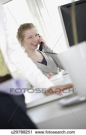 Girl with telephone receiver laughing in View Large Photo Image Stock Image - Girl with telephone receiver laughing in. Fotosearch