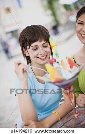 girlfriends enjoying icecream View Large Photo Image Stock Photograph - girlfriends enjoying icecream. Fotosearch