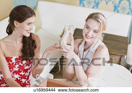 Picture - girls after a successful shopping day. Fotosearch