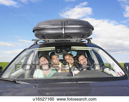 Stock Image - girls singing in car. Fotosearch