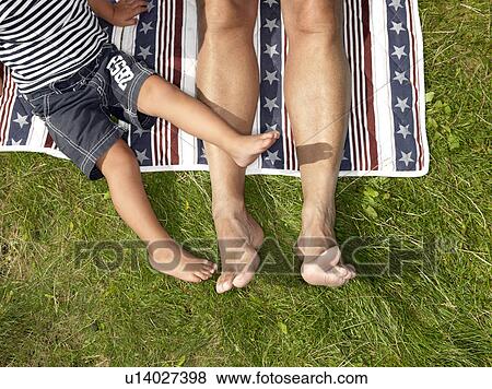 Stock Photo - Grandfather and boy on blanket. Fotosearch