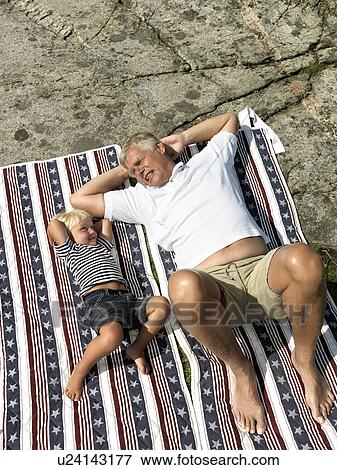 Grandfather and boy on blanket View Large Photo Image Stock Photo - Grandfather and boy on blanket. Fotosearch