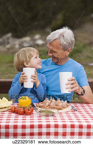 grandfather, grandson eating in mountain View Large Photo Image Stock Image - grandfather, grandson eating in mountain. Fotosearch