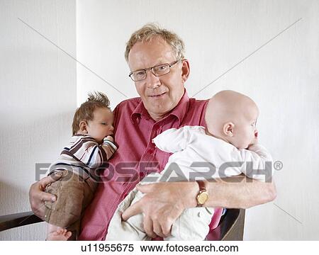 Grandfather holding two babies View Large Photo Image Stock Photography - Grandfather holding two babies. Fotosearch