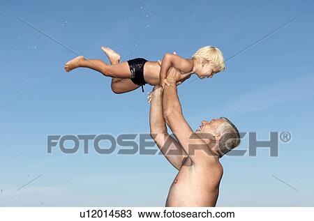 Grandfather playing with boy View Large Photo Image Stock Image - Grandfather playing with boy. Fotosearch
