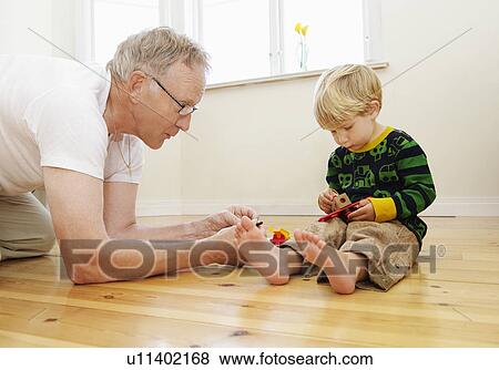 Grandfather playing with grandson View Large Photo Image Stock Photo - Grandfather playing with grandson. Fotosearch