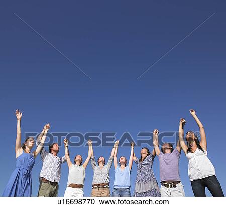 group of young people raising arms View Large Photo Image Stock Image - group of young people raising arms. Fotosearch