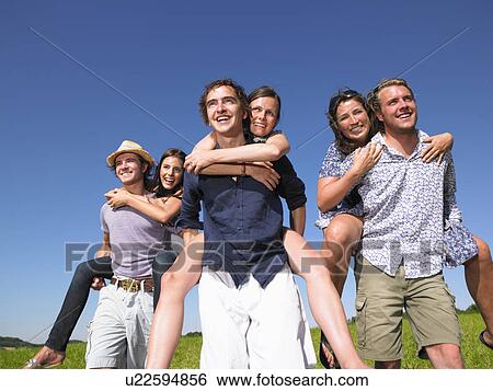 group of young people riding piggy back View Large Photo Image Stock Photograph - group of young people riding piggy back. Fotosearch