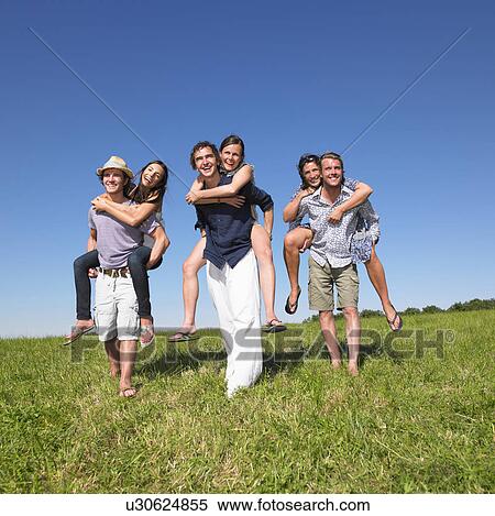 group of young people riding piggy back View Large Photo Image Stock Photography - group of young people riding piggy back. Fotosearch