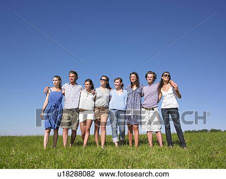 group of young people walking in field View Large Photo Image Stock Image - group of young people walking in field. Fotosearch