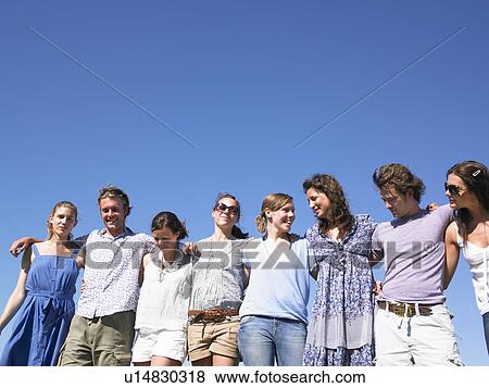 group of young people walking in field View Large Photo Image Stock Photo - group of young people walking in field. Fotosearch