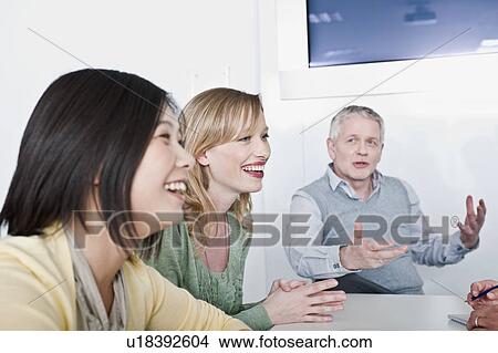 Picture - happy informal group meeting. Fotosearch