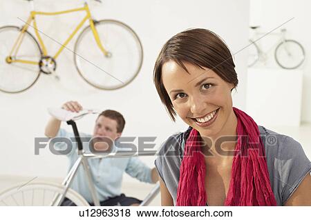 happy woman in bikestore View Large Photo Image Stock Photo - happy woman in bikestore. Fotosearch