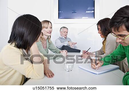 Stock Photography - informal group meeting. Fotosearch