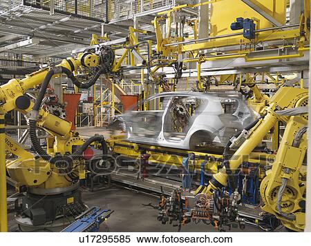 Stock Photography - Machine Working On Car In Plant. Fotosearch