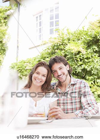 Man and woman having drink in country View Large Photo Image Stock Image - Man and woman having drink in country. Fotosearch