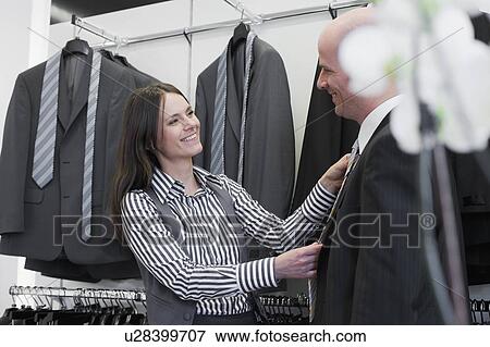 man and woman in clothing store View Large Photo Image Stock Photo - man and woman in clothing store. Fotosearch