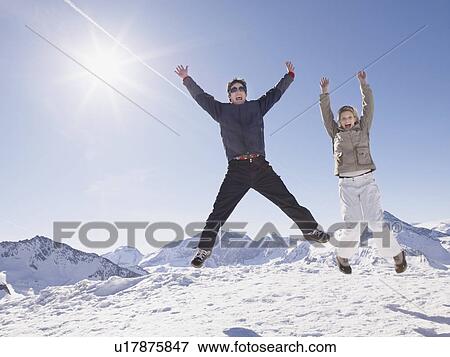 man and woman jumping up on mountain View Large Photo Image Stock Photo - man and woman jumping up on mountain. Fotosearch