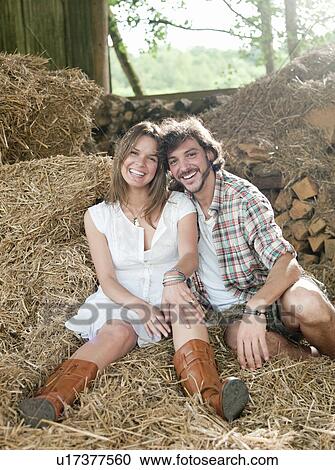 Man and woman lying in hay barn View Large Photo Image Stock Image - Man and woman lying in hay barn. Fotosearch