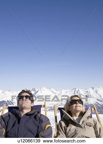 man and woman on deck chair up mountain View Large Photo Image Stock Photo - man and woman on deck chair up mountain. Fotosearch