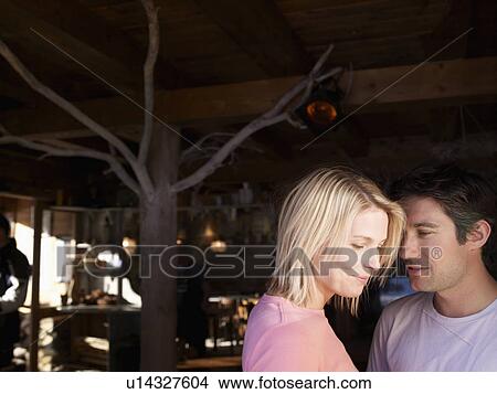 Picture - man and woman talking in bar. Fotosearch