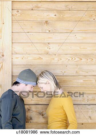 Stock Photograph - man and woman touching heads. Fotosearch