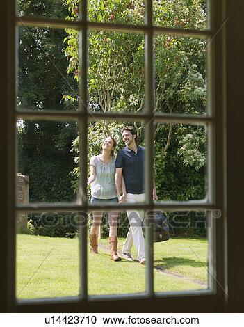 Man and woman walking down garden path View Large Photo Image Stock Image - Man and woman walking down garden path. Fotosearch