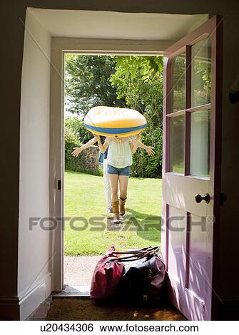 Stock Photograph - Man and woman walking down path. Fotosearch
